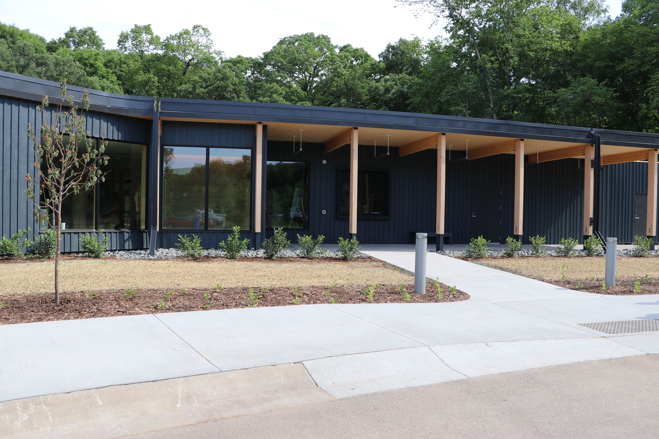 Raving Landing is dark blue with a low profile and natural wood columns